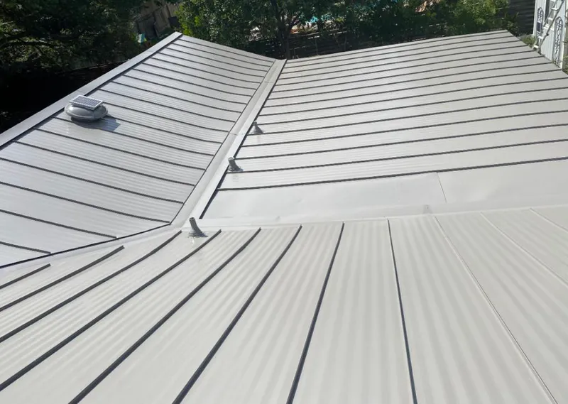 Solar attic fan installed on a metal roof for Roof Ventilation in Lehigh